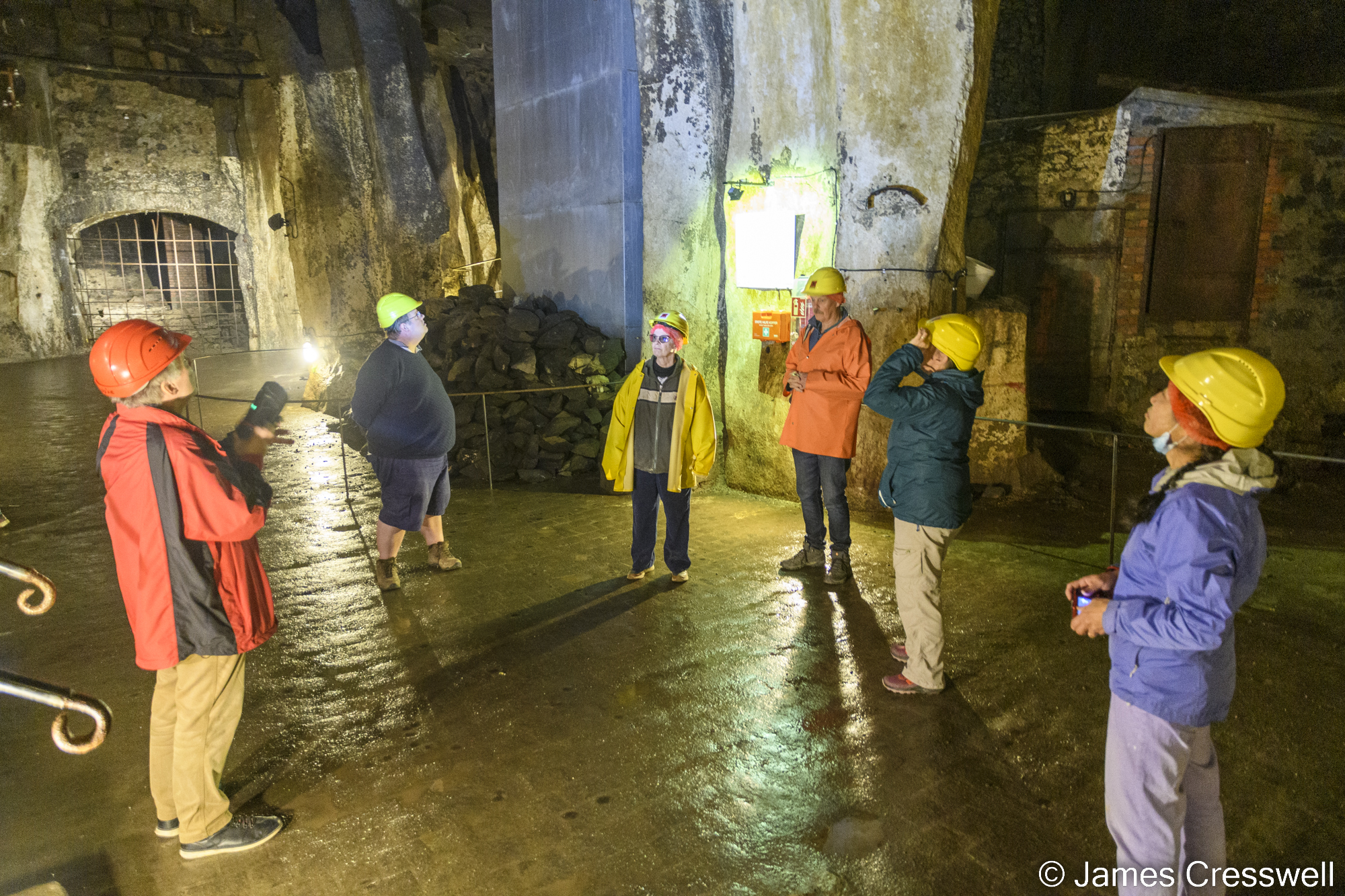 People on a tour in an underground cellar